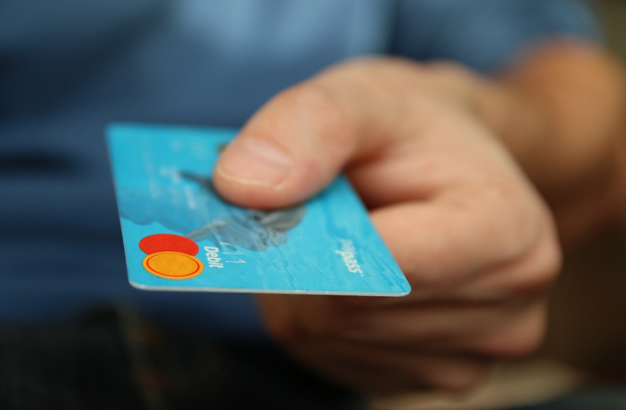 Man holding credit hard in his hand